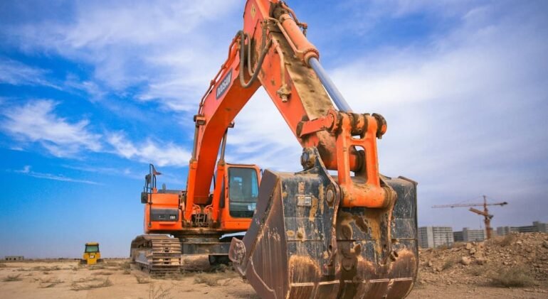 Earthworks excavation and hauling operation showing mass grading productivity for accurate sitework estimating.